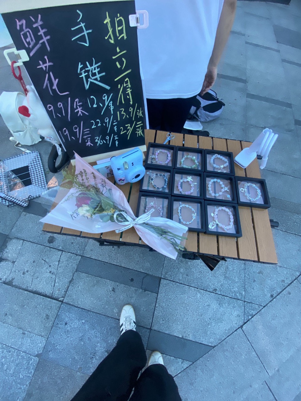Handwritten price board with bracelets and flowers, Qixi 2025